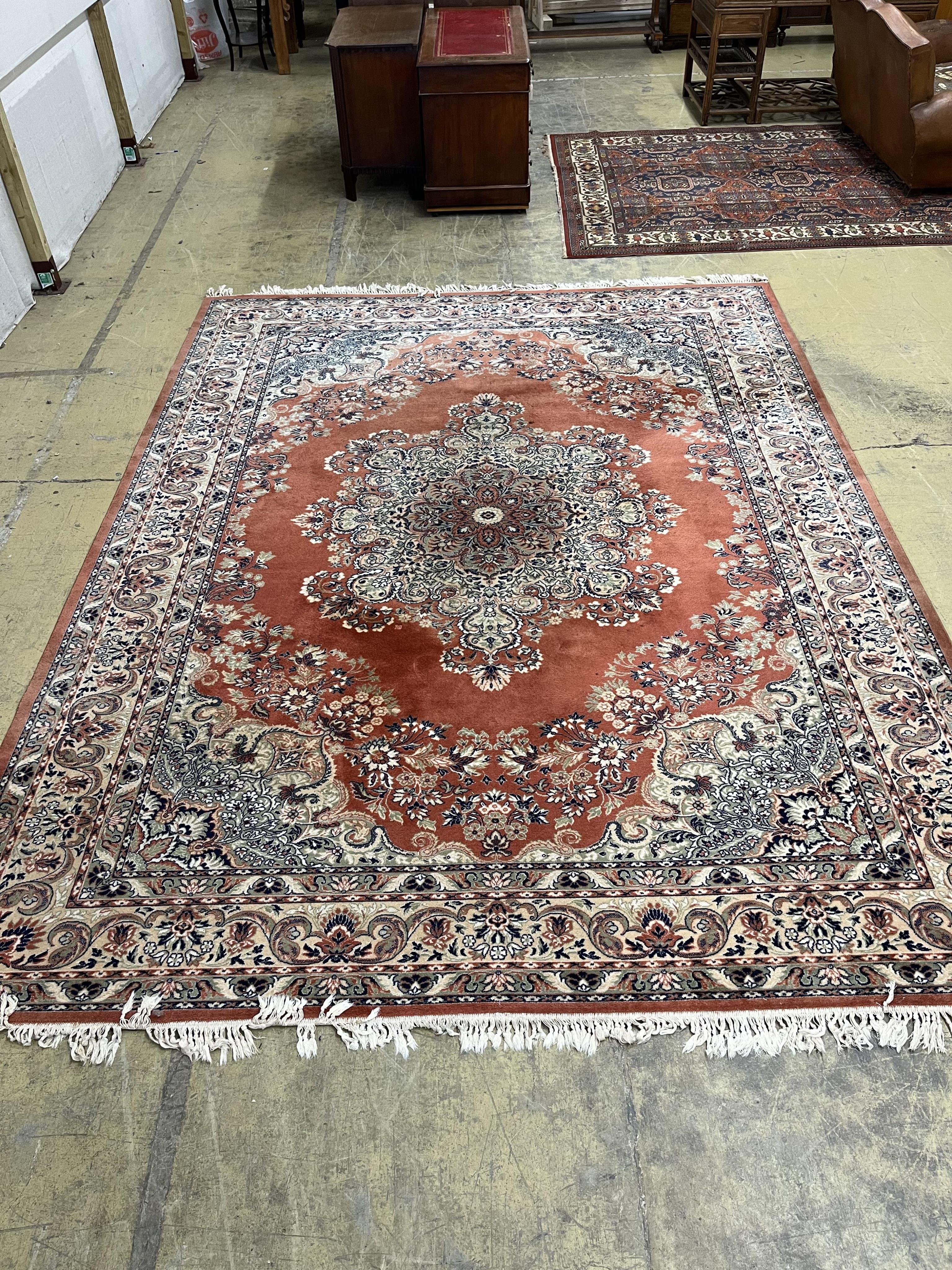 A North West Persian style red ground carpet, 360 x 280cm. Condition - poor